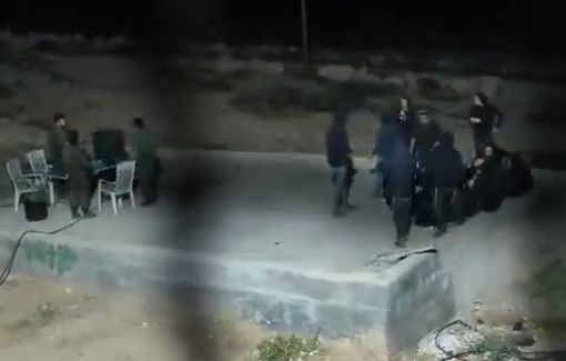 Thumbnail preview image for the video titled: In Wadi a-Rakhim, settlers besieging the home of Yusuf Shinaran, playing football there alongside soldiers