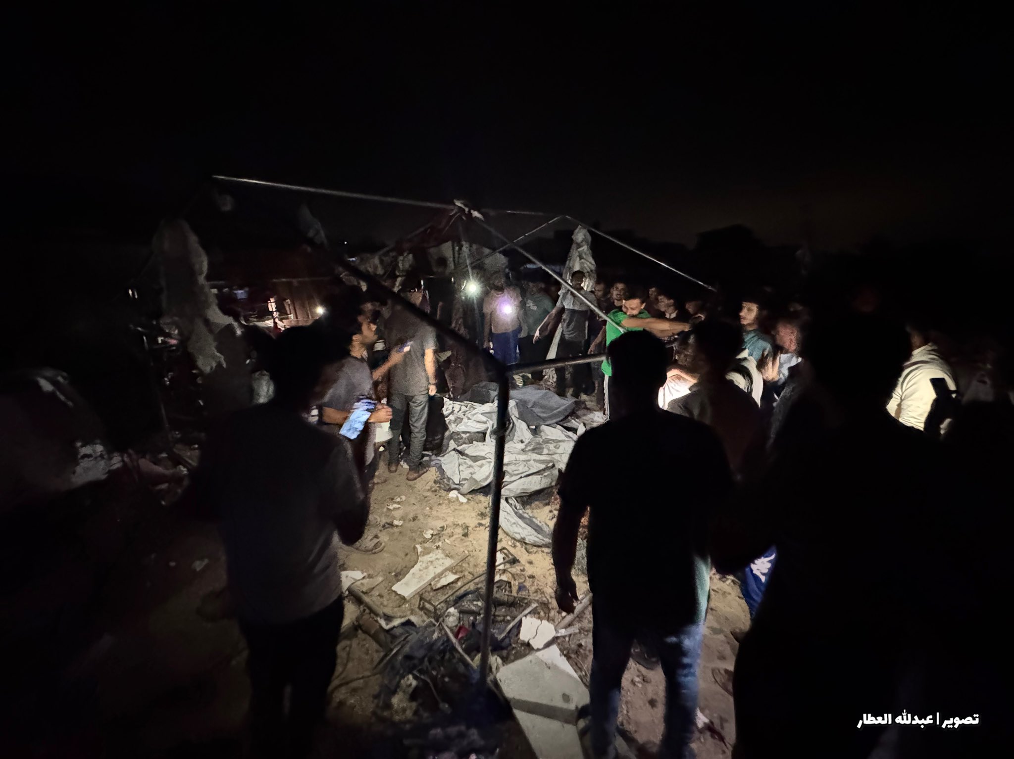 Thumbnail preview image for the video titled: Civilians gather at massacre scene to help rescue efforts