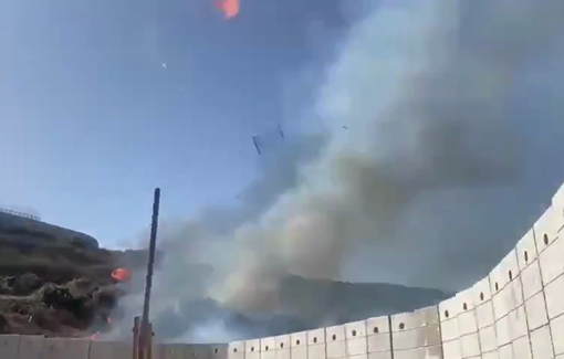 Thumbnail preview image for the video titled: Israeli soldiers using a catapult to launch fire shells towards South Lebanon & set fire to our land