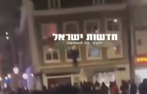Thumbnail preview image for the video titled: Israeli Maccabi hooligans stole Palestinian flags from homes and even set a Palestinian flag on fir